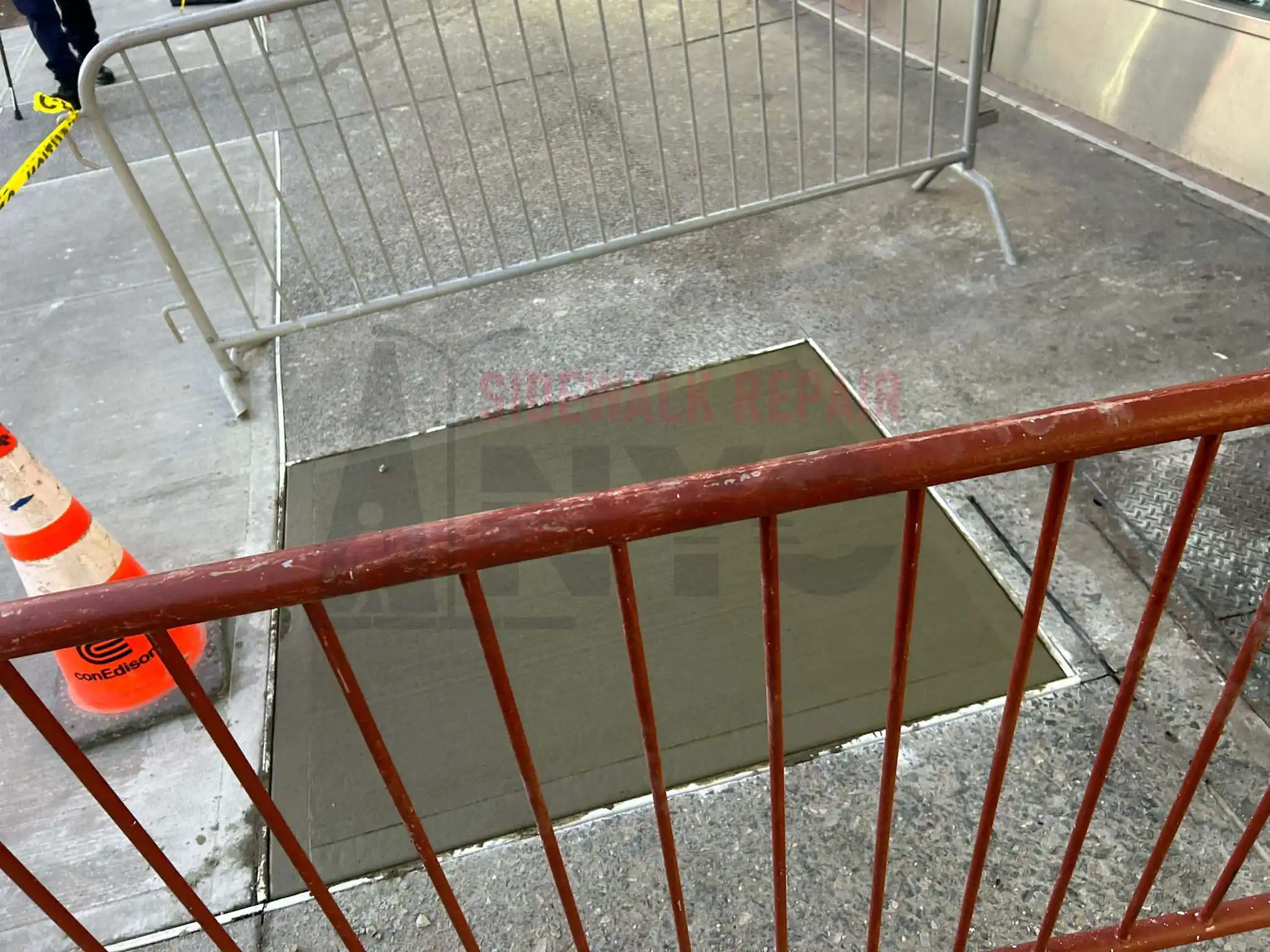 A cracked concrete sidewalk.
